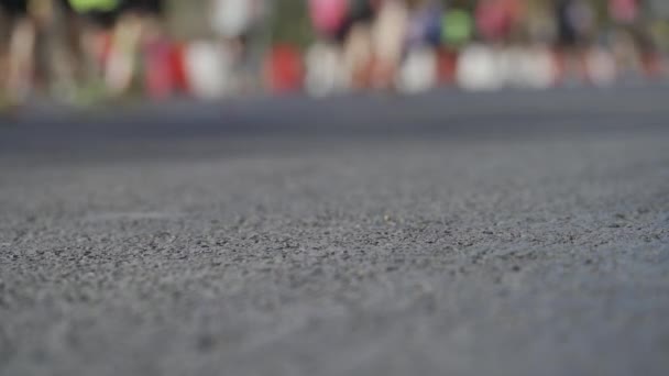 Endless city marathon video loop featuring blurred athletes on asphalt, space for text. - Footage, Video