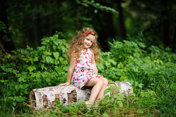 Little pretty girl in the green garden  - Photo, image