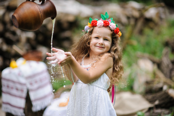 Little pretty girl in the green garden  - Φωτογραφία, εικόνα