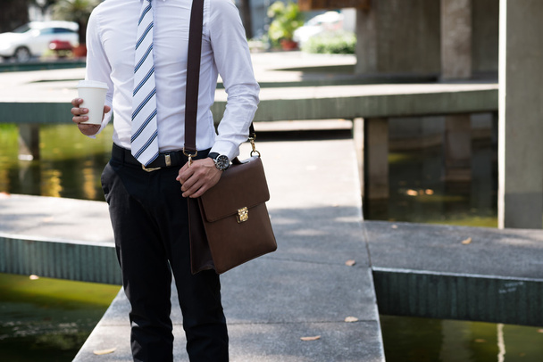 Businessman with coffee and briefcase - Foto, Bild