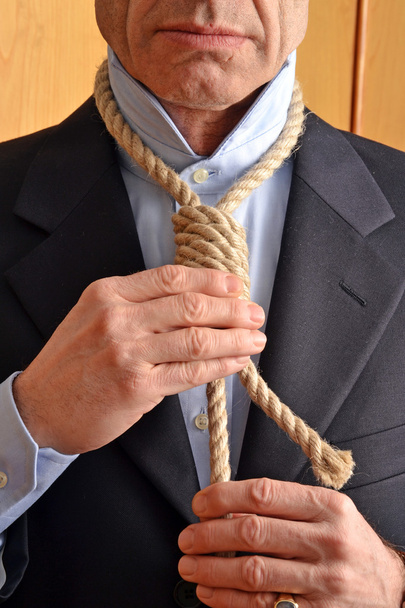 Hangman adjusting a noose rope - Foto, imagen