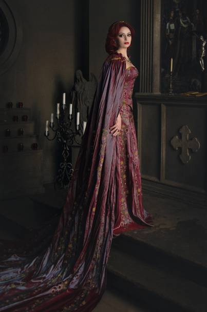 Woman in royal garb and golden crown - Fotó, kép
