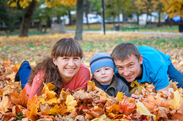 Happy family on walk in autumn park - Foto, Imagen