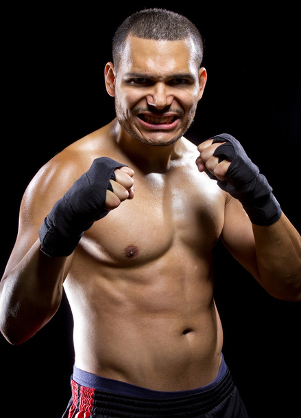 MMA fighter flexing muscles - Photo, Image