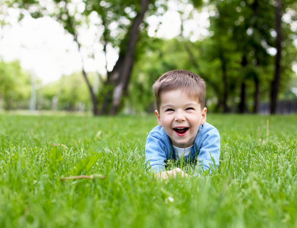 Portrait of a little boy outdoors - 写真・画像