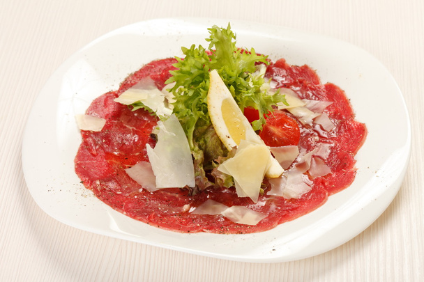 Meat Carpaccio with Parmesan Cheese - Фото, изображение