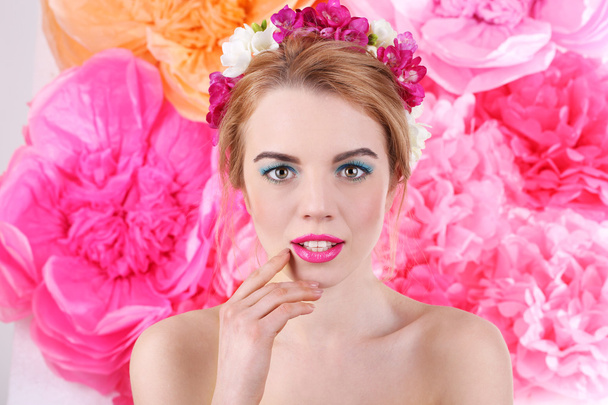 Young woman with flowers - 写真・画像