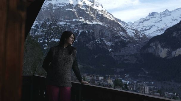 Absorbed by Nature - Woman Contemplating Swiss Alps in Winter - Foto, afbeelding