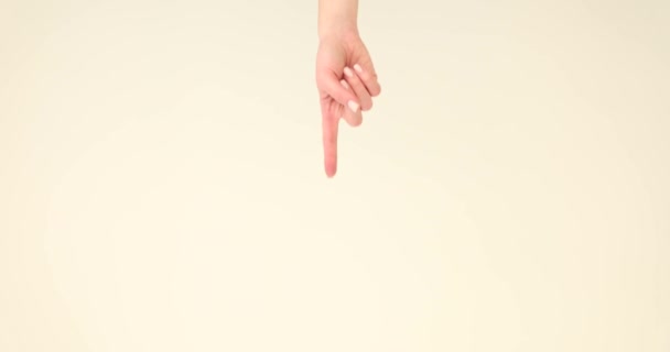 Index finger pointing from above to empty space on white background 4k movie. Place for advertising concept - Footage, Video