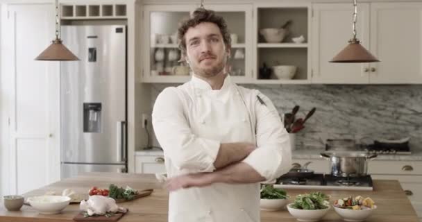 Crossed arms, smile and face of chef in kitchen for cooking at modern home or house. Happy, confidence and portrait of private male culinary artist with positive attitude for preparing meal or dinner. - Footage, Video