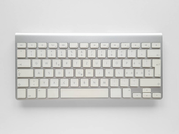 Wireless keyboard on white desk background. - Photo, Image