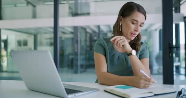 Business woman, laptop and writing in video call with diary for agenda, proposal or schedule planning at office. Person or employee taking notes in book by computer in virtual meeting at workplace. - Footage, Video