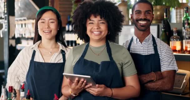 Welcome, restaurant and portrait of team at bar with manager, waiter and waitress at startup with digital app. Bistro, service barman and diversity, happy small business owner at cafe with tablet - Footage, Video
