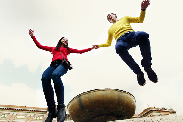 loving couple jumping on the fountain in the garden of the Vatican in Rome Italy - Foto, imagen