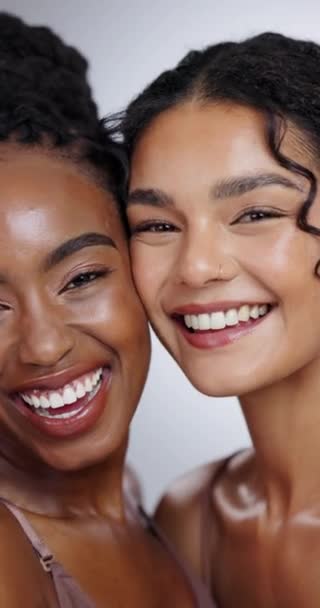 Women, face and beauty with laughing in studio with facial treatment, diversity or glowing skin. Friends, model and portrait with mock up for cosmetics, dermatology and support on white background. - Footage, Video