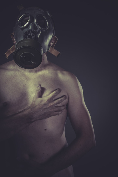 Nude man with gas mask - 写真・画像