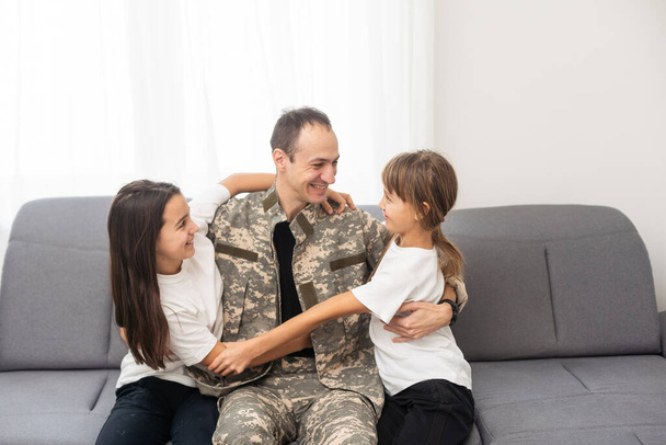Little girl with her military father at home. High quality photo - Photo, Image