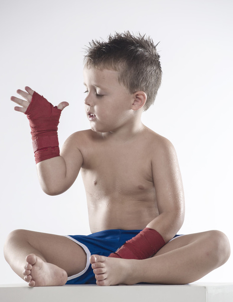 Child boxer in shorts and bandages - Fotografie, Obrázek