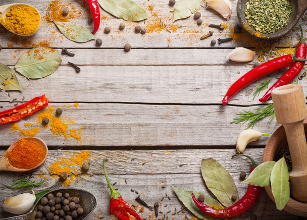 Colorful spices on a wooden background - Foto, imagen