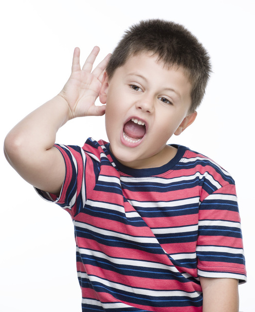 Young boy with his hand up to his ear - Photo, Image