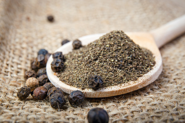 black pepper on the wooden spoon - Photo, Image