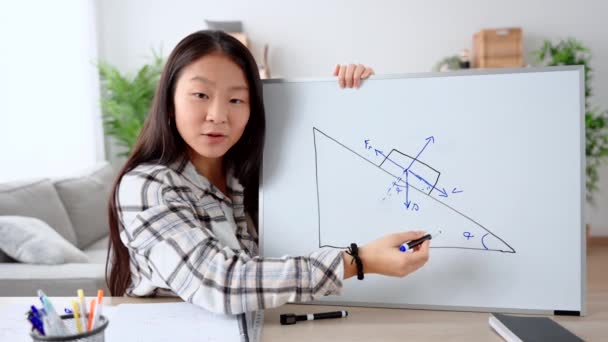 Chinese young woman teaching online. Teacher recording tutorial about physics or mechanics. - Footage, Video