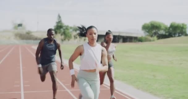 People, running and winning race in fitness, sports or marathon together on stadium track. Active group of athletes in practice, training or outdoor exercise with winner for sprint or competition. - Felvétel, videó