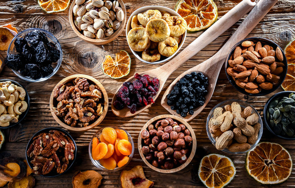 Composition with a variety of dried fruits and assorted nuts. Delicacies. - Foto, Bild
