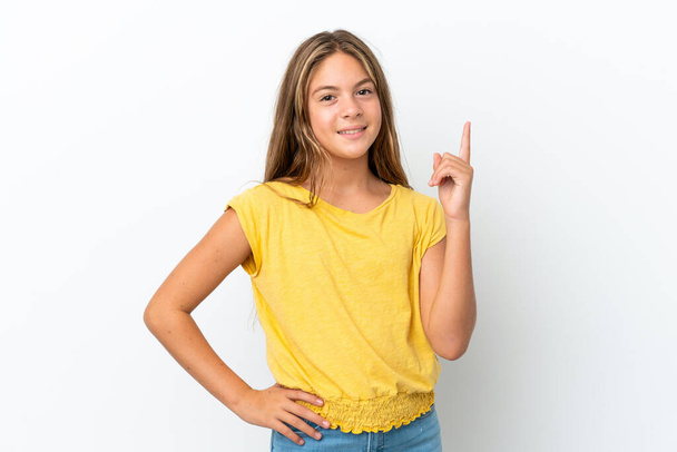 Little caucasian girl isolated on white background showing and lifting a finger in sign of the best - Photo, Image