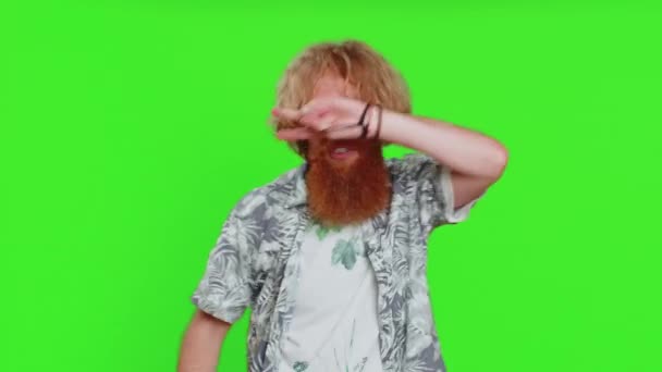 Happy smiling man listening music and dancing disco fooling around having fun expressive gesticulating hands relaxing on party making funny moves. Redhead bearded guy isolated on chroma key background - Footage, Video
