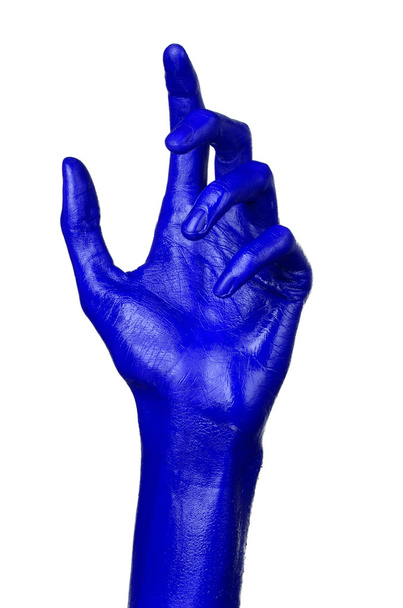 Mão azul sobre fundo branco, isolado, pintura
 - Foto, Imagem