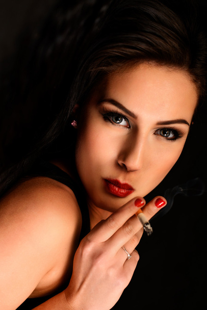 Beautiful woman smocking - Foto, Imagem