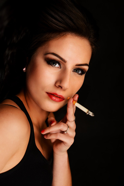 Beautiful woman smocking - Photo, Image