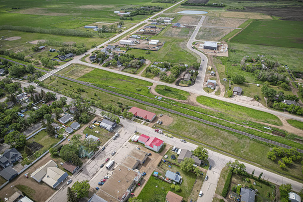 Drone image capturing the town of Dalmeny in Saskatchewan during the summer season, showcasing its vibrant greenery and serene atmosphere - Photo, Image
