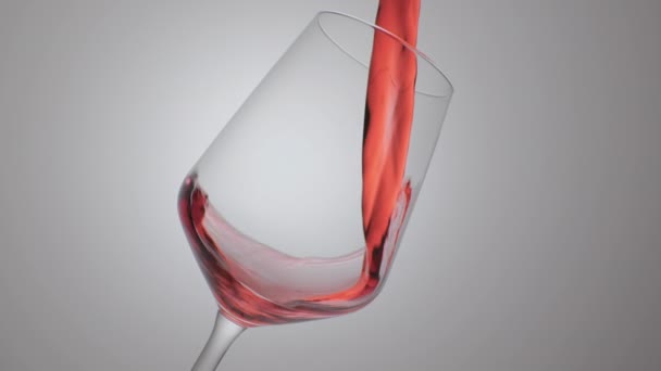 Червоне вино утворює красиву хвилю. Вино наливається в келих для вина на білому тлі. Крупним планом. Повільний рух заливання червоного вина з пляшки в чашку. - Кадри, відео