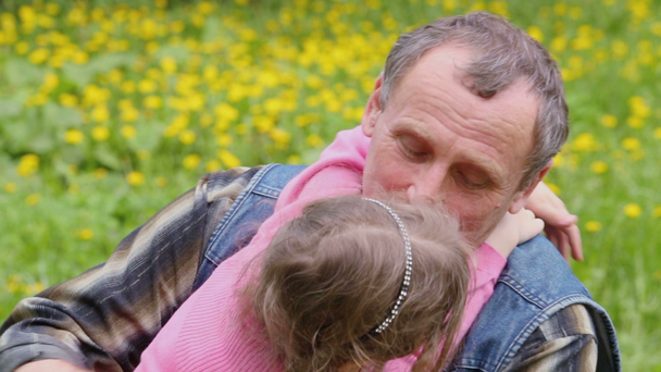Granddaughter hugs grandfather - Footage, Video