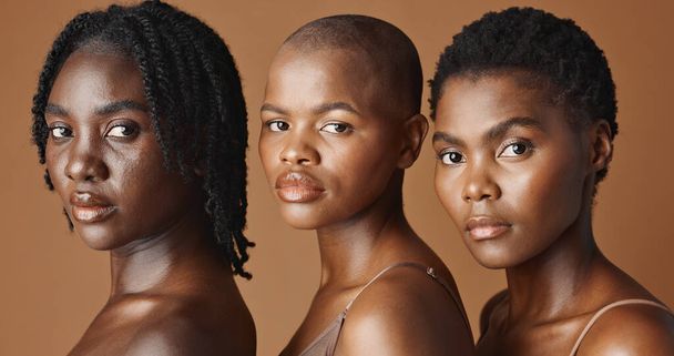 Skincare, beauty and young black women in studio with glowing, natural and facial routine. Wellness, cosmetic and portrait of African female friends with dermatology treatment by brown background - Photo, Image