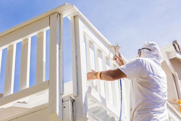 House Painter Spray Painting A Deck of A Home - Photo, Image