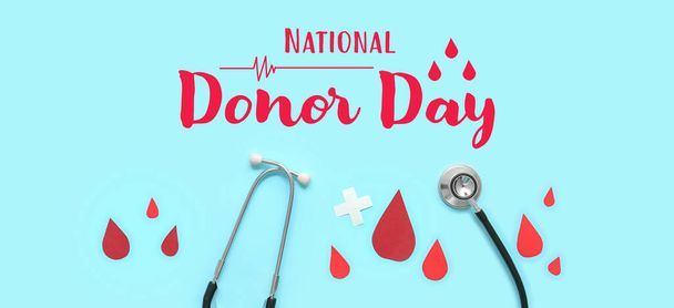 Banner de sensibilización para el Día Nacional del Donante con estetoscopio y gotas de sangre de papel - Foto, imagen