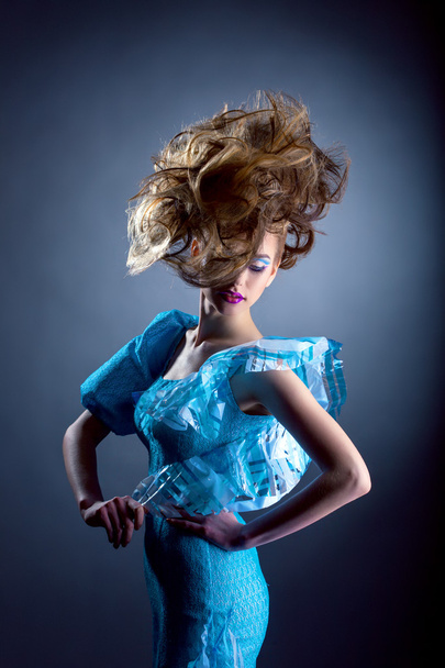 Creative model posing in blue dress - Foto, Imagen