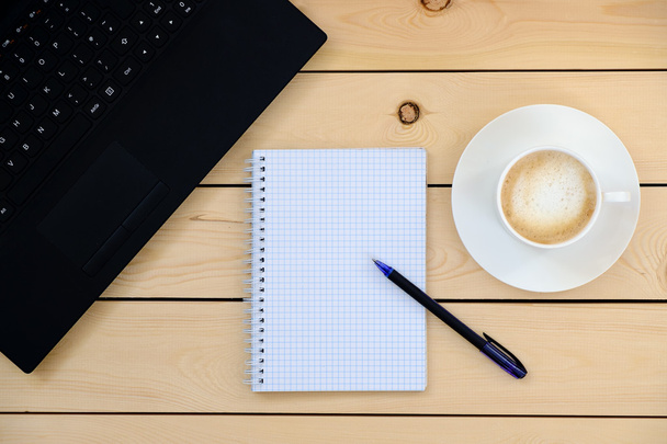 Laptop, empty notebook, pen, cup of coffee - business concept - Photo, Image