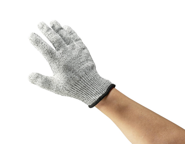 Mannelijke hand met messenbestendige handschoenen op witte achtergrond. - Foto, afbeelding