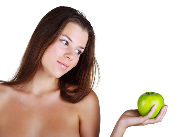 Beautiful girl holds in a hand green apple - Fotoğraf, Görsel