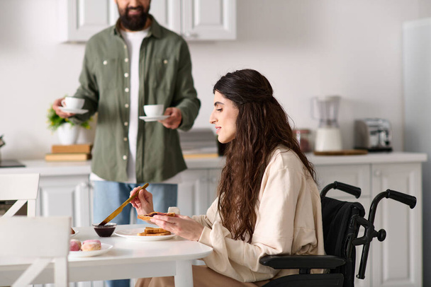 beautiful jolly woman with disability in wheelchair enjoying breakfast with her bearded husband - Φωτογραφία, εικόνα