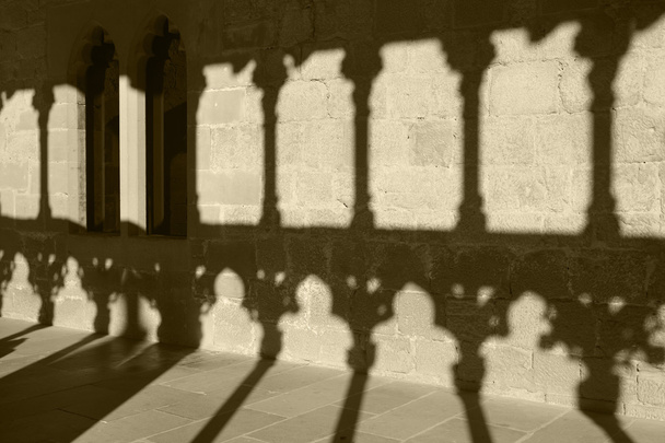 Romanesque arcade with columns and shadows in Olite. Navarra, Sp - Photo, Image