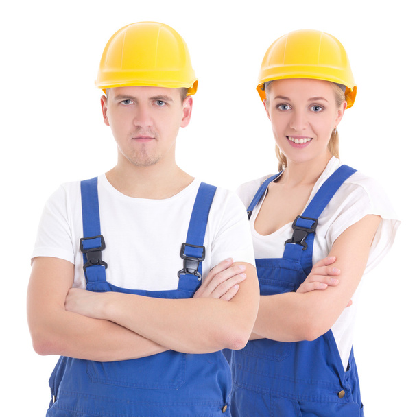 молодий чоловік і жінка в синій формі будівельника ізольовані на білому
 - Фото, зображення