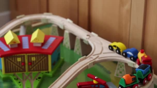 Boy playing with toy trains - Video, Çekim