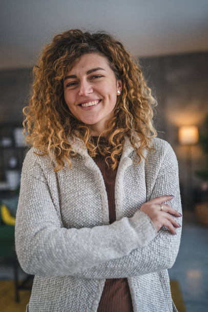 Portrait of adult caucasian woman with curly hair at home happy smile - Photo, Image