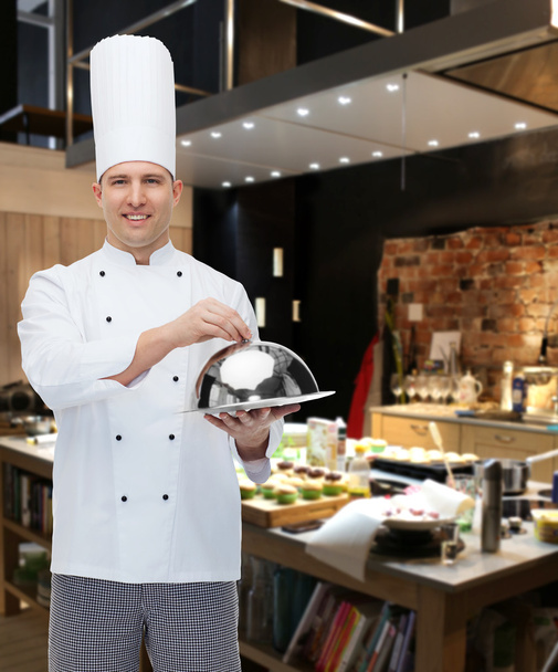 happy male chef cook holding cloche - Zdjęcie, obraz
