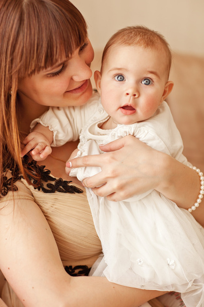 Picture of beuty young mother with adorable baby - Photo, Image